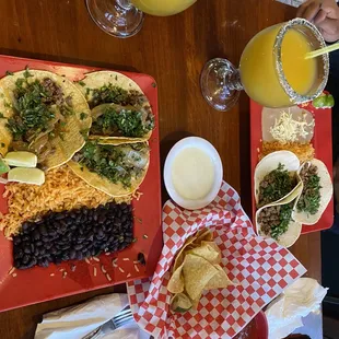 Steak tacos for both, chips, salsa, queso and mango margaritas!