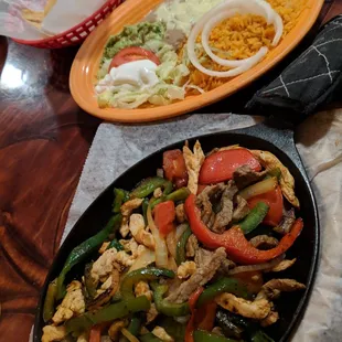 Chicken and beef fajitas with all the sides, and enough tortillas too.