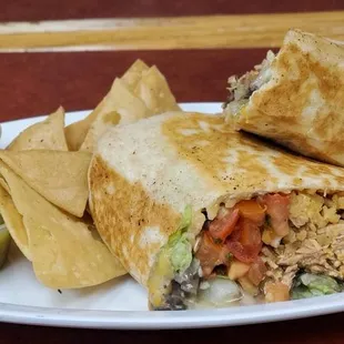 a burrito and chips on a plate