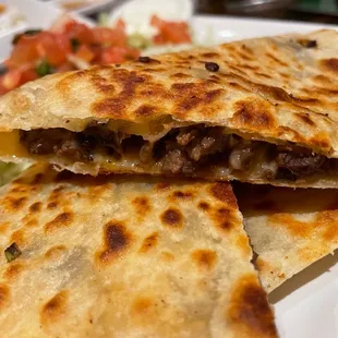 three quesadillas on a plate
