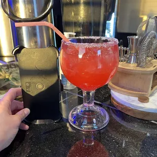 Strawberry margarita. iPhone 13 Pro Max case for size comparison. Very sweet so it&apos;s awesome lol