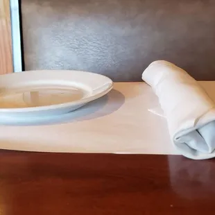 a plate and napkin on a table