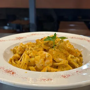 a plate of pasta with shrimp