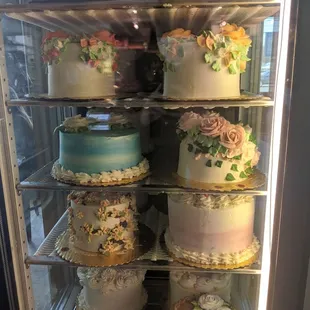 Beautifully designed cakes on display.