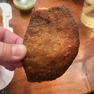 Kid&apos;s meal chicken tenders looking like burnt tortilla chips.