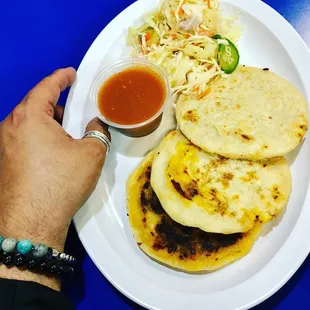 a person holding a plate of food