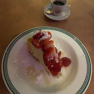 Angie&apos;s homemade cheesecake with white chocolate sauce and strawberry&apos;s. And of course espresso.