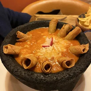 Flautas immersed in a roasted flavor red sauce, oooooh yeah!