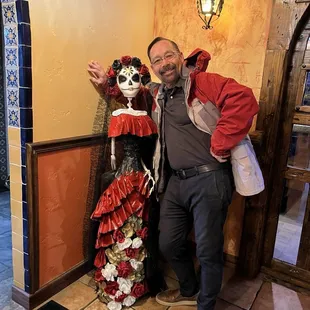 The front entrance with a patron and Day of the Dead señorita!