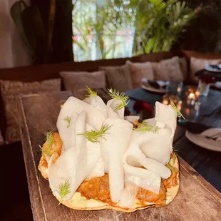 a piece of food on a wooden table