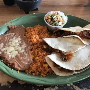 carne asada tacos with refried beans, rice, and pico