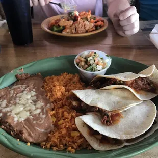 dinner with my friend, he got "the chicken plate". chicken, broccoli, rice, and queso.