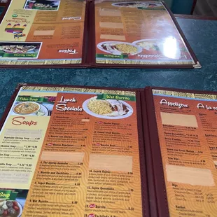 a person sitting at a table with a menu