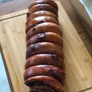 a sliced sausage on a cutting board