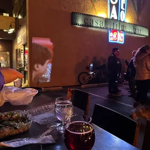 a glass of wine and a plate of food