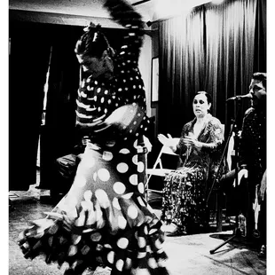 Leslie Roybal dancing while Valeria Montes clap to the rhythm and the song by Adrian Cabeza.