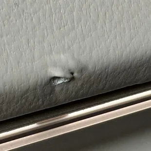 Damaged leather from drivers side door