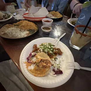 Baja Fish taco  and Al Pastor. Rice and beans were great and big enough to share!