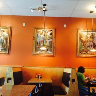 a couple of people sitting at a table in a restaurant