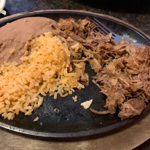 Old and dry carnitas.
