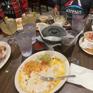 Photo of the cramped table. We had to stack our tortilla container on the chips. All of our knees were touching.