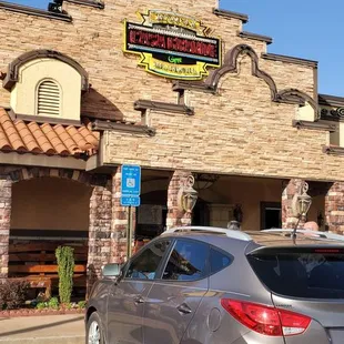 a car parked in front of a restaurant