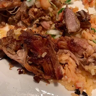 a plate of meat and rice