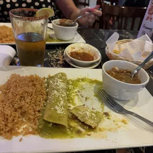 Shredded beef enchiladas in green sauce with whole beans &amp; rice