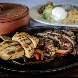 Grilled Mixed Fajitas. Chicken and Beef. Rice and Beans.