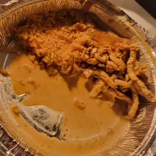 A few strips of chewy chicken....hardened portion of beans that is , at least super small and less threatening, and a half cup of rice.