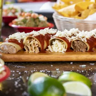 Enchiladas! Freshly made and served with our homemade red sauce.