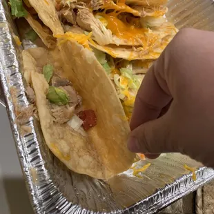 Poor quality taco. Three pieces of chicken, two pieces of lettuce, and one taco.