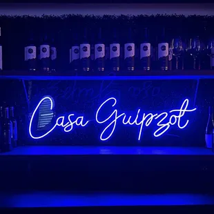 a neon sign in a bar