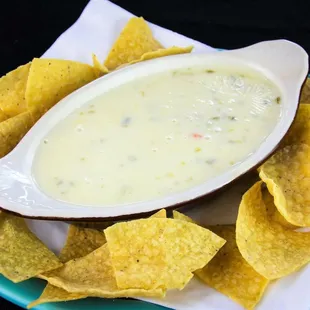 a bowl of quesadi with tortilla chips