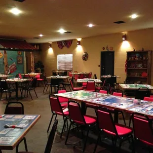 a dining room with tables and chairs