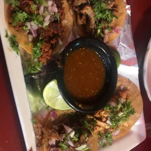 Street tacos (carne asada, chicken, carnitas, and chorizo) with tomatillo salsa