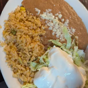 Freshly cooked rice and amazing refried beans. Just like the rest of the hot food served.