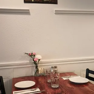 Dogs playing poker over one of the tables.