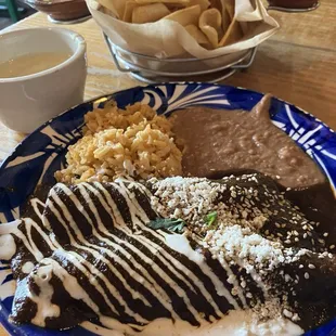 Chips with Blanco Queso, with two salsas and Chicken Mole Enchiladas with a flavor uniquely Casa Jacaranda!