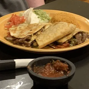 The steak super quesadilla fajita : there was a good amount of steak, a side of rice, lettuce, tomatoes, guacamole and sour cream