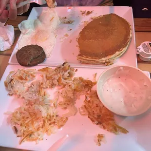 Pancake plate and a side of hash browns.