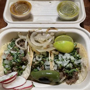 Street Tacos- Carne Asada w/ rabanos, grilled onions, limon and salsa on the side. Delicious