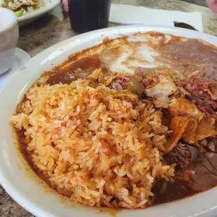 Beef enchiladas, rice, and beans