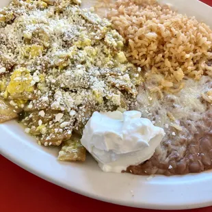 a plate of mexican food on a red table