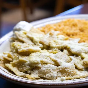 Chilaquiles Verdes freshly dusted with Parmesan cheese