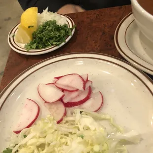 The pozole&apos;s garnishes.