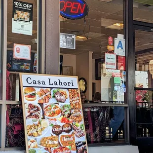 The restaurant is tucked behind the covered patio seating.