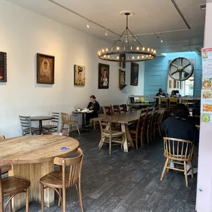 a dining area with tables and chairs