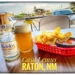 a basket of chips and a bottle of beer