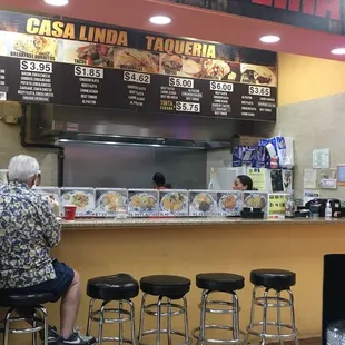 a woman sitting at a counter